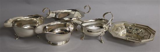 Four assorted silver sauceboats and a silver bonbon basket, 16 oz.